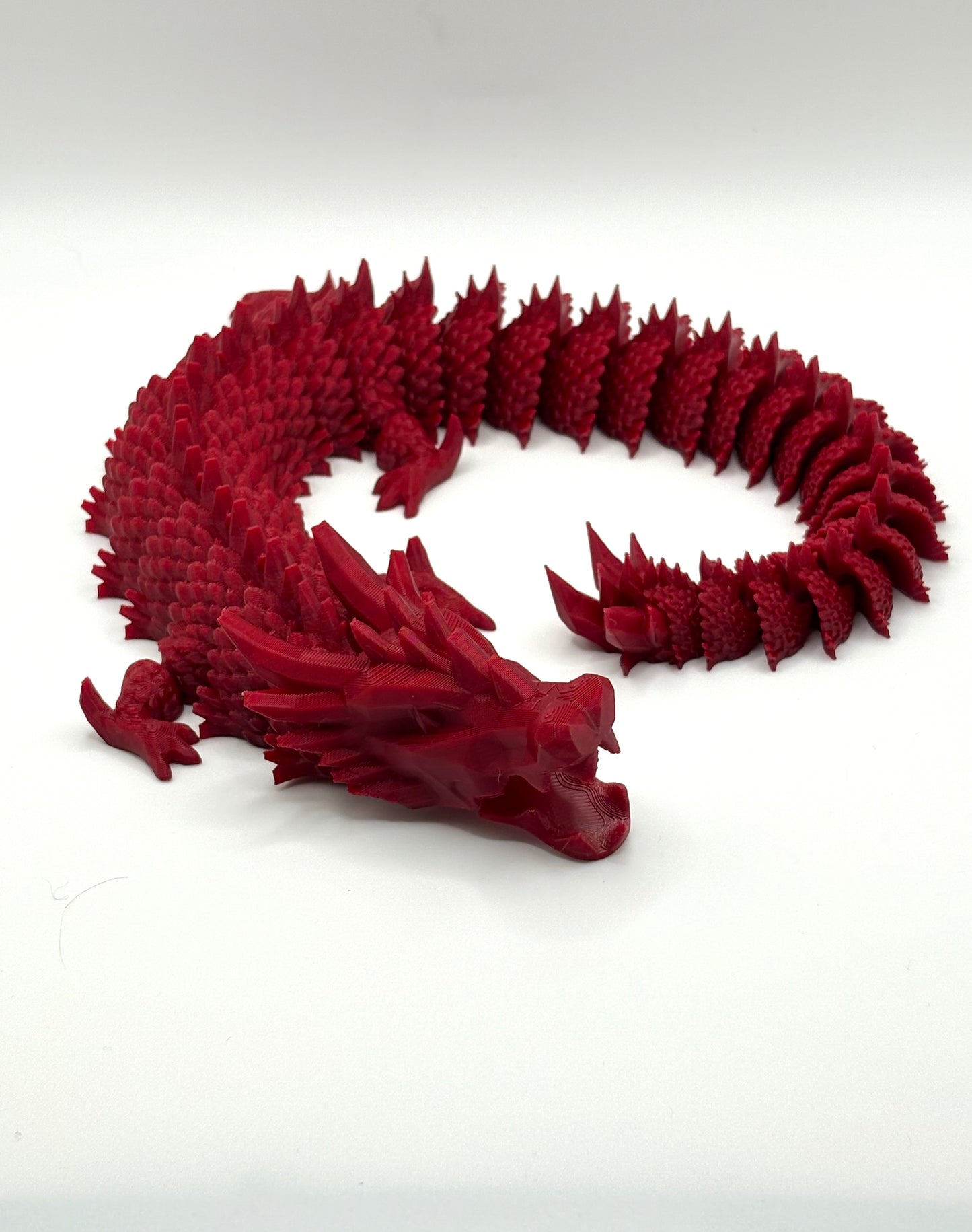 3D printed articulating dragon in vibrant colors
