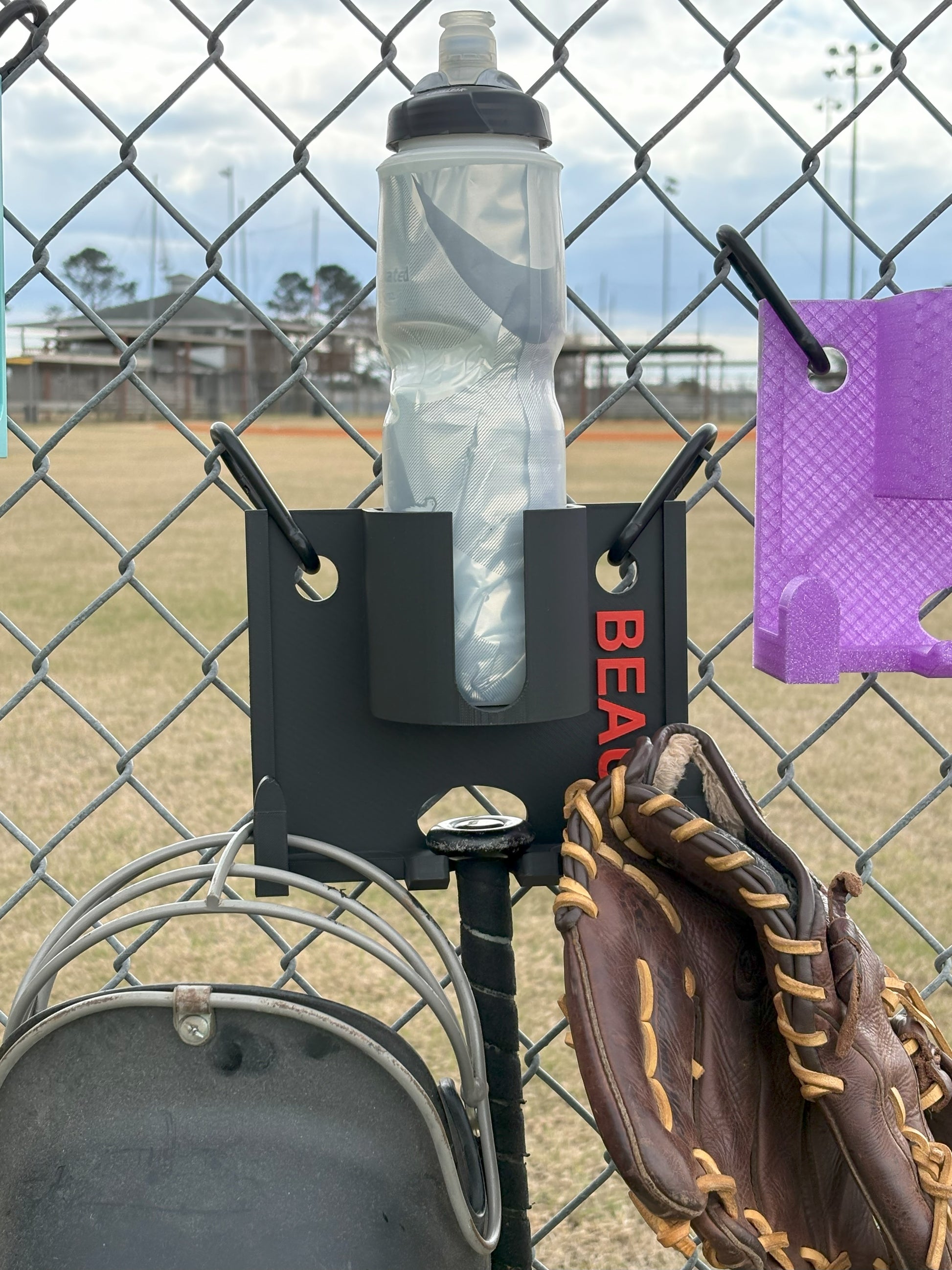 Compact dugout gear holder attached to chain-link fence