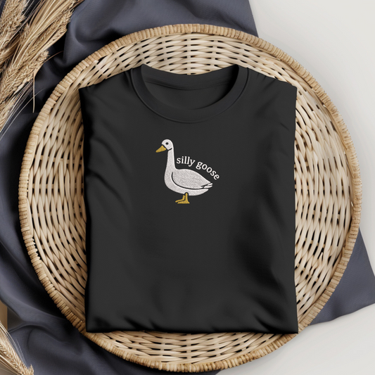 Black t-shirt with a goose graphic and 'silly goose'  embroidery